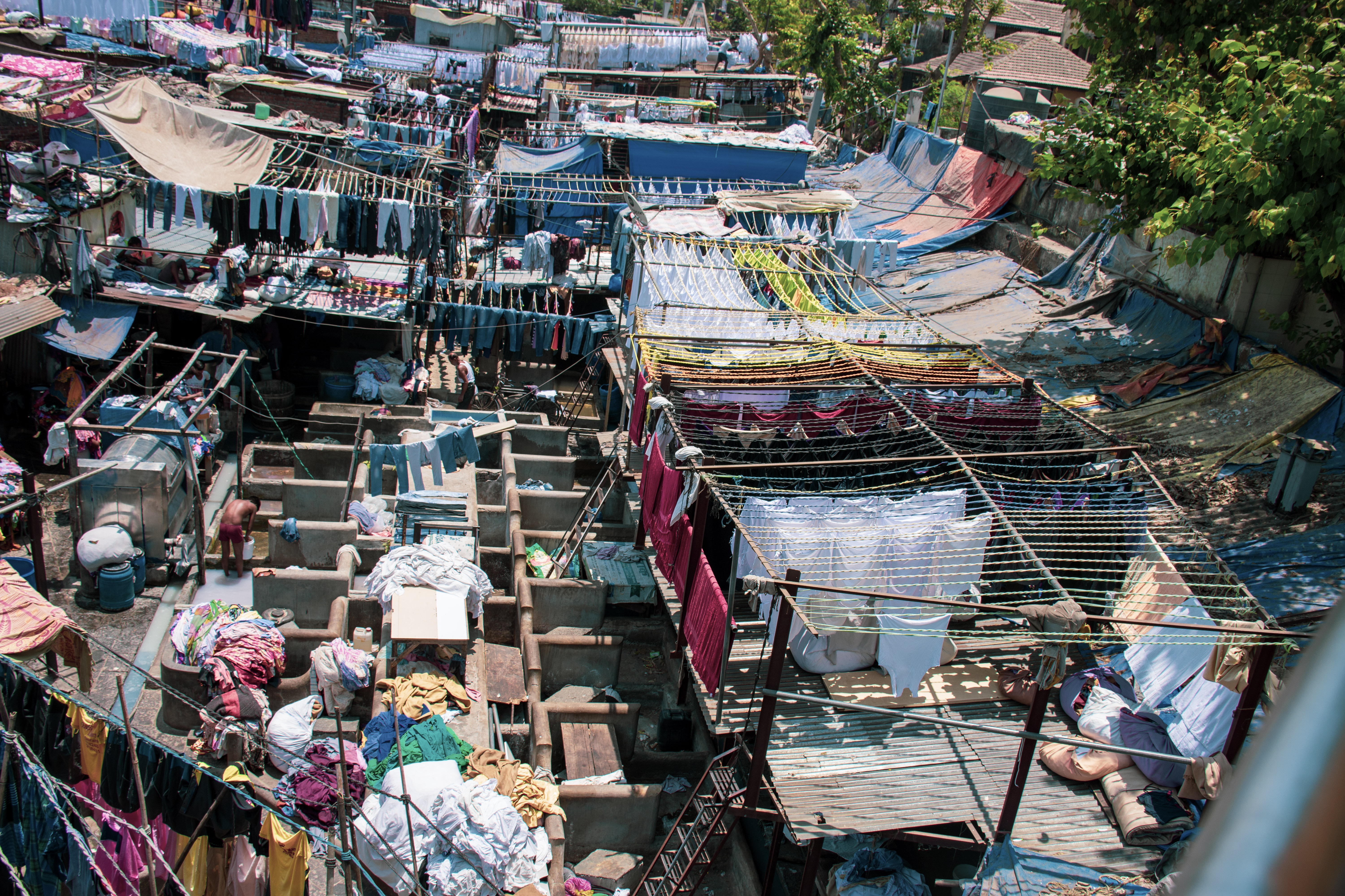 Mumbai neighborhood with people working.